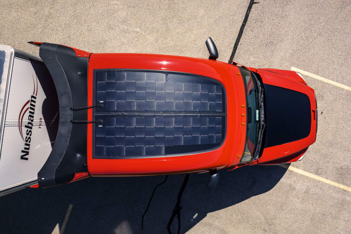 View of Nussbaum truck cab from above, showing solar panels on the roof.