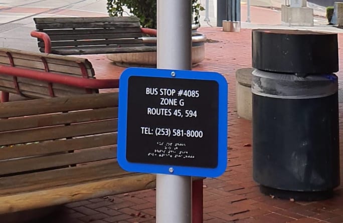 A new accessible bus stop sign that Pierce Transit is installing as part of their pilot program.