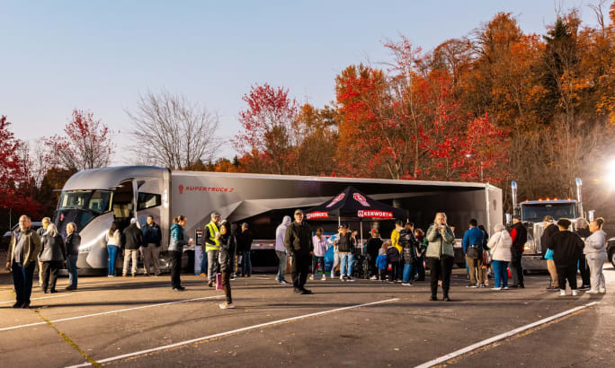 tractor trailer with crowd in front