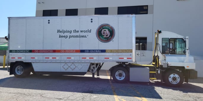 Electric yard tractor with pup trailer