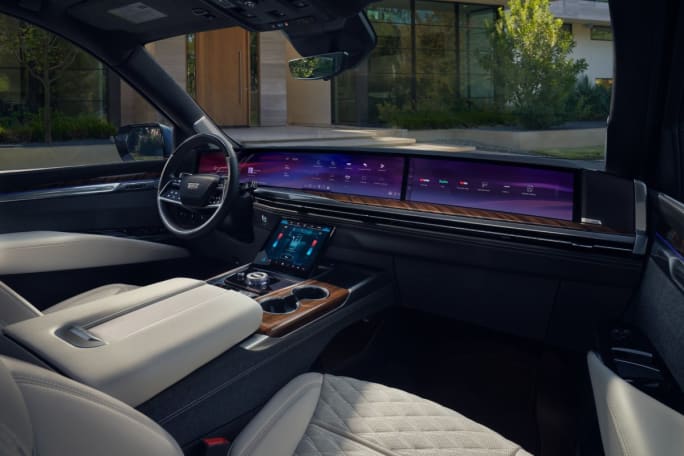 Interior of a 2025 Cadillac Escalade and its pillar-to-pillar dashboard.