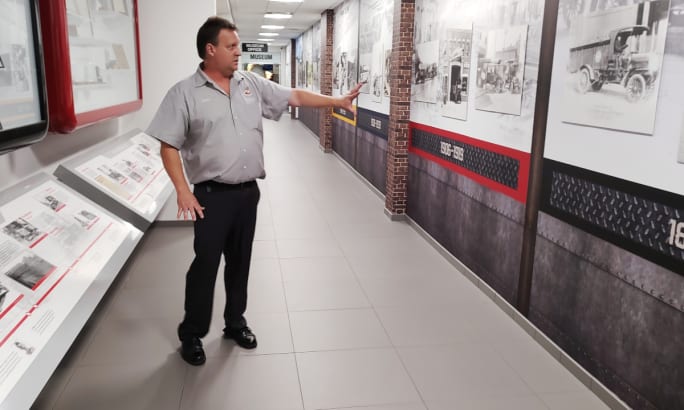 Man guides tour at Mack Historical Trucks Musuem