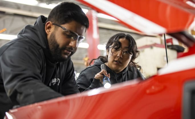 Technicians working on a vehicle