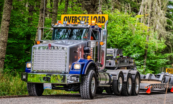A large truck pulling an oversize load.