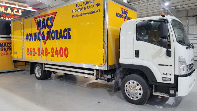Mac's Moving & Storage showcases one of it's Isuzu Medium-Duty Trucks