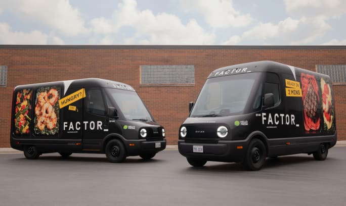 Two branded HelloFresh electric delivery vans