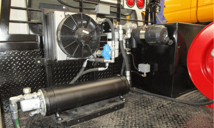 Closeup photo of an air compressor installed in the bed of a Toyota Land Cruiser.