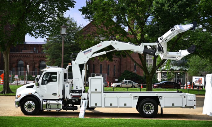 Large tire changer truck on exhibit.
