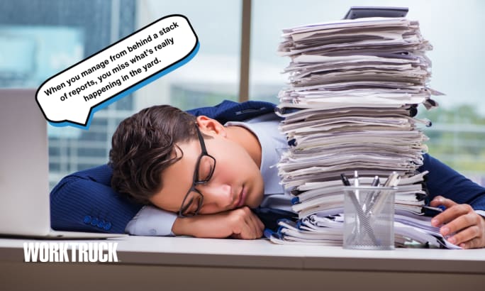 Overwhelmed office worker asleep on a desk next to a giant stack of papers, wearing glasses and a suit.