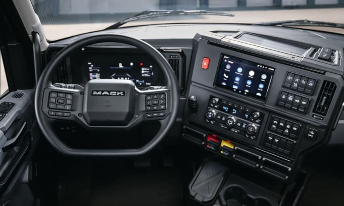 Interior view of driver area and steering wheel and dash in a new Mack Anthem.