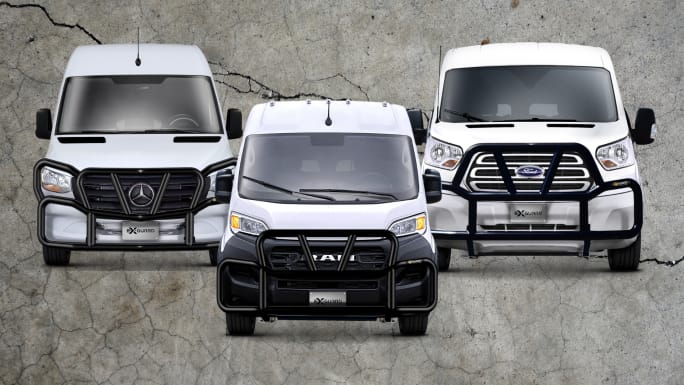 Three commercial vans (Mercedes-Benz, Ram, and Ford) equipped with Ex-Guard grille guards parked side by side.