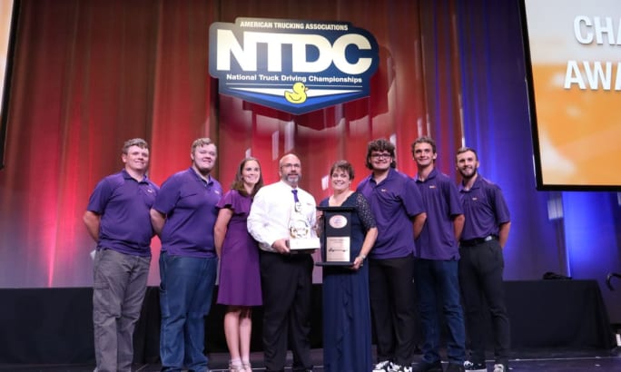 Grand Champion David Comings poses with his family at the conclusion of the National Truck Driving & Step Van Championships in Minneapolis. 