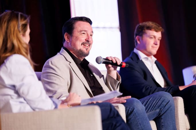Chris Oliver of Trucker path speaks in a panel discussion at Wex OTR Summit