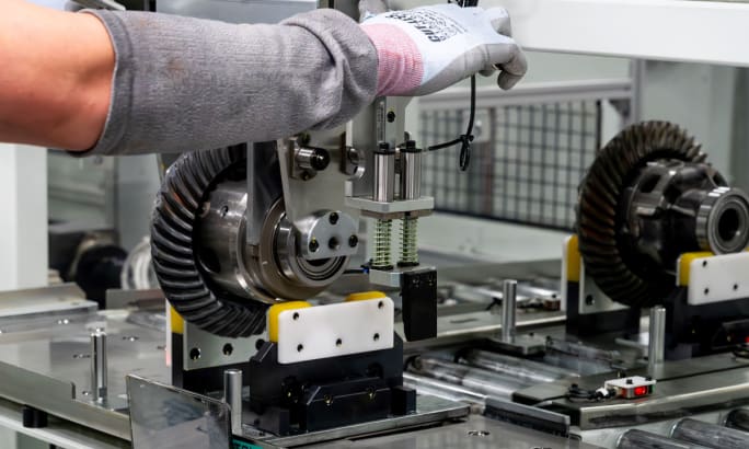 Toyota Alabama worker assembling differential component for Tacoma, Tundra, and Sequoia production line.