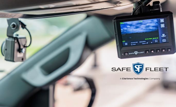 in-car view of windshield and a small screen with a  video image