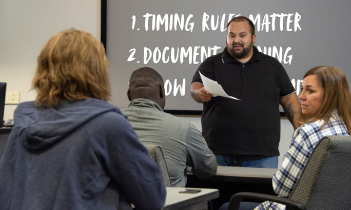 Supervisor leads DOT reasonable suspicion training, reviewing timing rules and documentation requirements for drug and alcohol testing decisions.