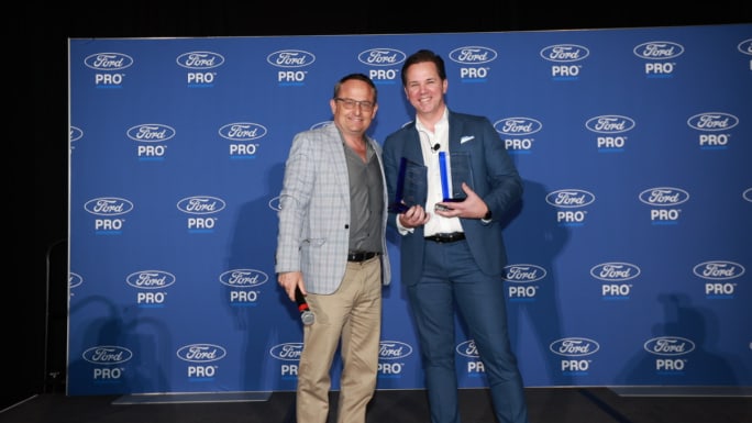 Award winners pose with trophies at the Work Truck Week commercial vehicle awards ceremony recognizing fleet innovation and work truck technology.
