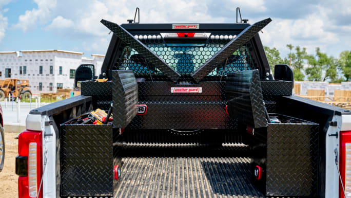 Open truck bed with Weather Guard toolboxes and organized storage compartments for equipment.