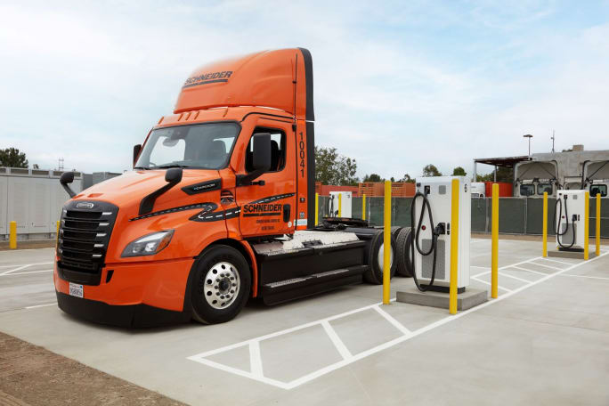Orange electric Schneider eCascadia at charging station