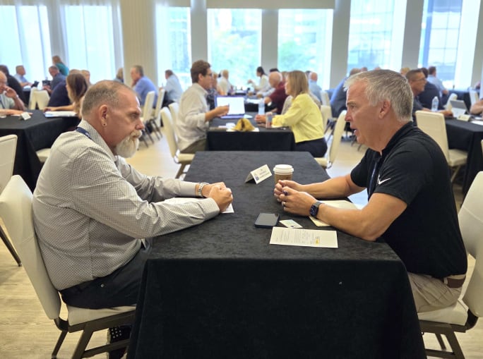 Attendees participate in one-on-one speed networking sessions during the 2026 NSTA Annual Meeting & Convention in Denver, meeting at tables throughout the room to discuss business opportunities, partnerships, and student transportation solutions.