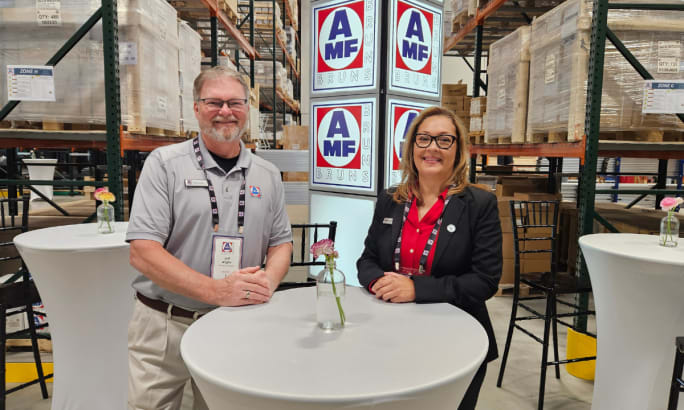 AMF Bruns national account managers Maritza Valentin and Jeff Allgire stand in the new building’s manufacturing space.