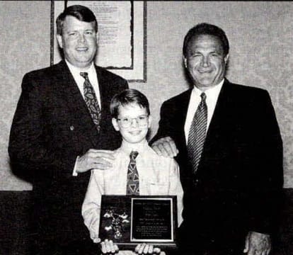 Kellie Dean of Dean Transportation accepts the School Bus Fleet 1995 Contractor of the Year award, standing with SBF Publisher Frank Di Giacomo and Dean’s son Patrick at the NSTA convention.