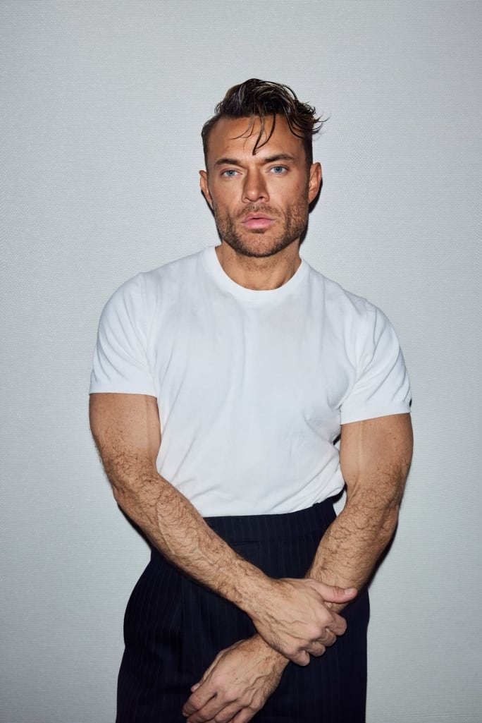 A man in white tshirt and black pants