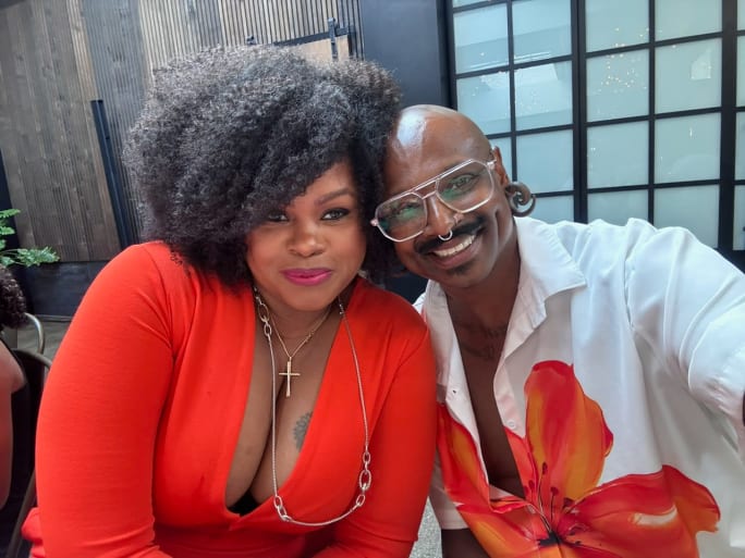 a woman and man posing together for a picture