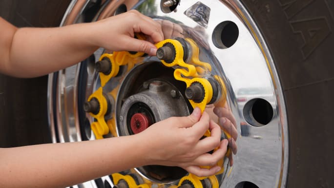 a product photo of lug nut indicators on a tire