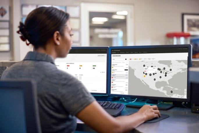 a woman sits at a computer with the My International dashboard pulled up