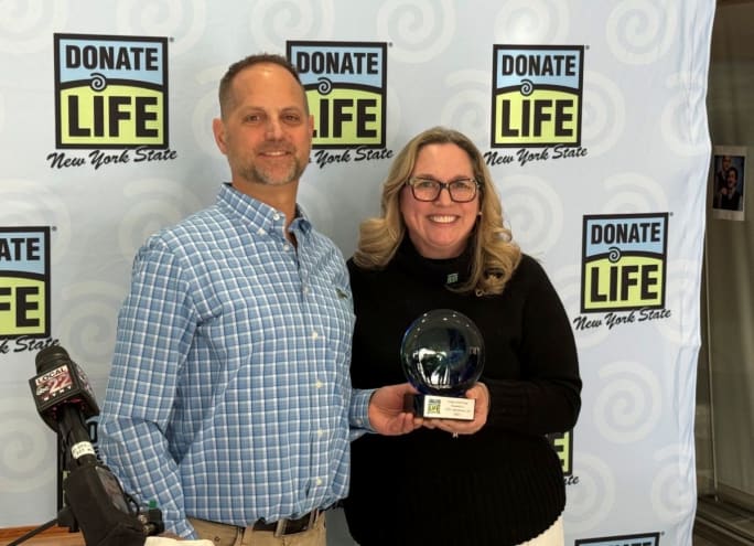 Jason Ellis and Aisha Tator with the Dealer of the Year award