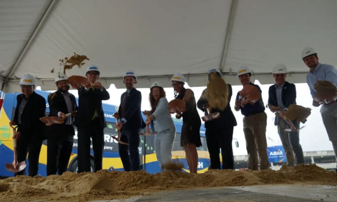 DASH employees and city partners break ground on electric bus chargers.