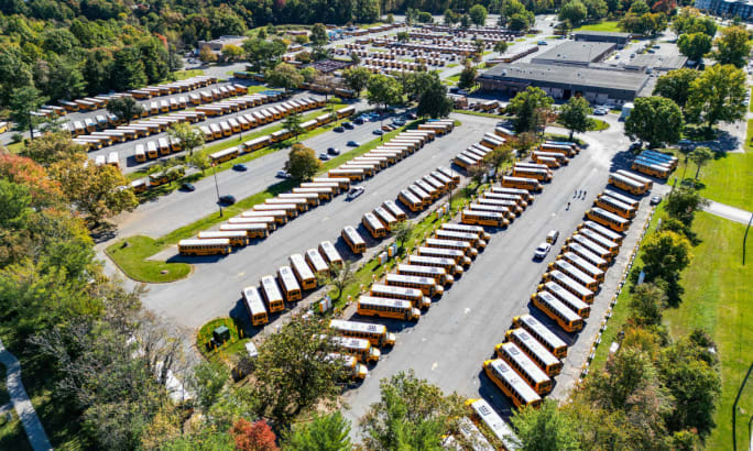 An aerial view of a school bus depot.