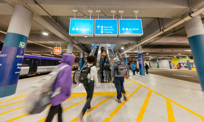 Riders walk through a WeGo Transit station.