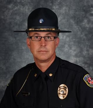 Lance Evans in a state trooper uniform