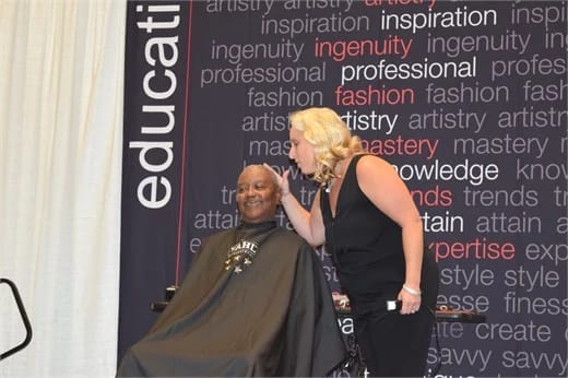 An attendee gets a fresh fade.