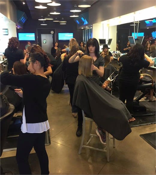 The team from Eric Fisher Salon rocking it at the Empowering Women Cut-a-thon in Wichita, Kansas.