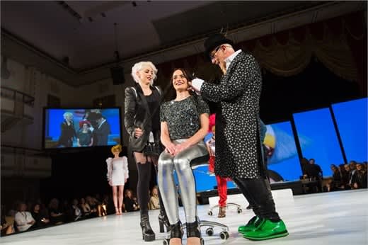 Mary Cuomo and Robert Cromeans (for Paul Mitchell) put the finishing touches on a model.