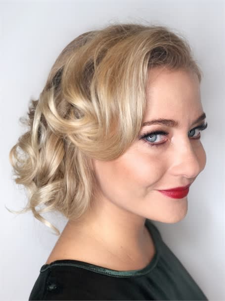 Sparkle, shine pigments, cut-creases and a red lip make for the perfect holiday beauty look.