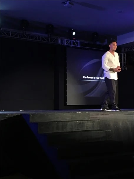 Mark Bustos tells the audience to discover their passion and how they can change the world for the better.