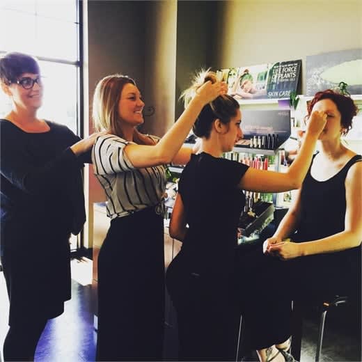 Team members at Joli Salon and Spa in Lexington, KY, using their talents to support each other.