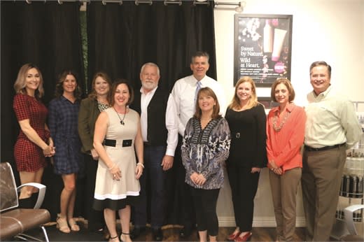 Congressman Darin LaHood (center in tie) hosts a community roundtable with salon owners and industry professionals to discuss the implications of legislation for a tip tax
