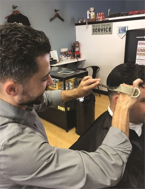 Silvestro's specialized Velcro device he uses to hold a comb.