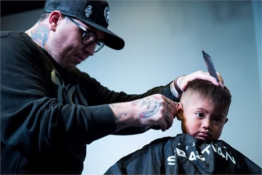 Spanky Caudill cuts a child’s hair in Guatemala.