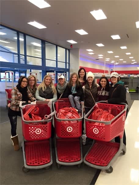 Team members from Taj Salon and Spa in Brooklyn Park, MN, shop at Target for the Adopt a Family program.