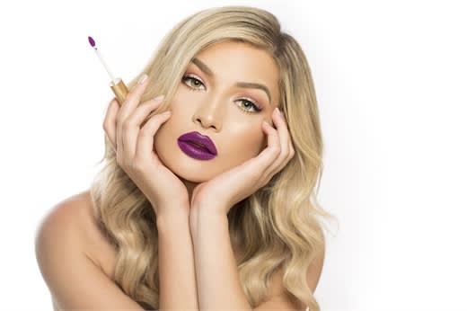 Vibrant berry lipcolor is trending for spring, like GrandeLips HydraPlump Liquid Lipstick in Razzle Berry.