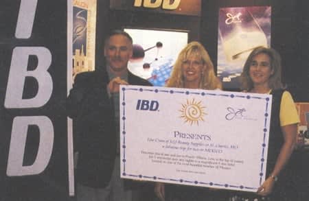 Lisa Crum (middle) of J&J Beauty Supplies in St. Charles, MO., and a guest will head for a 7-day trip to Puerto Vallarta, compliments of IBD (company president Lee Tomlinson is on left).