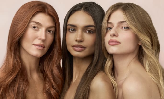 three women posing together