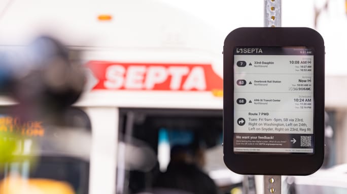 A SEPTA arrival display mounted on a bus stop pole.