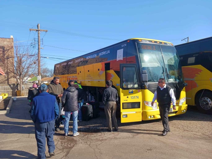 A Tornado bus with passengers.